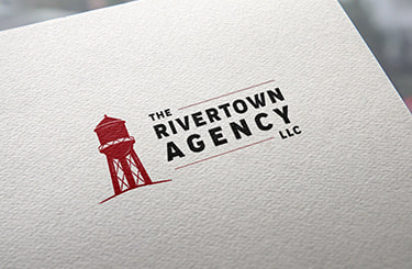 The Rivertown Agency LLC logo printed on the paper